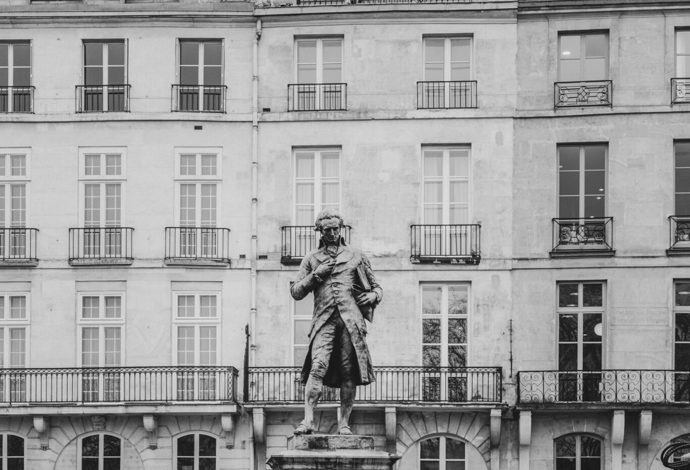 The statue in front of the building
